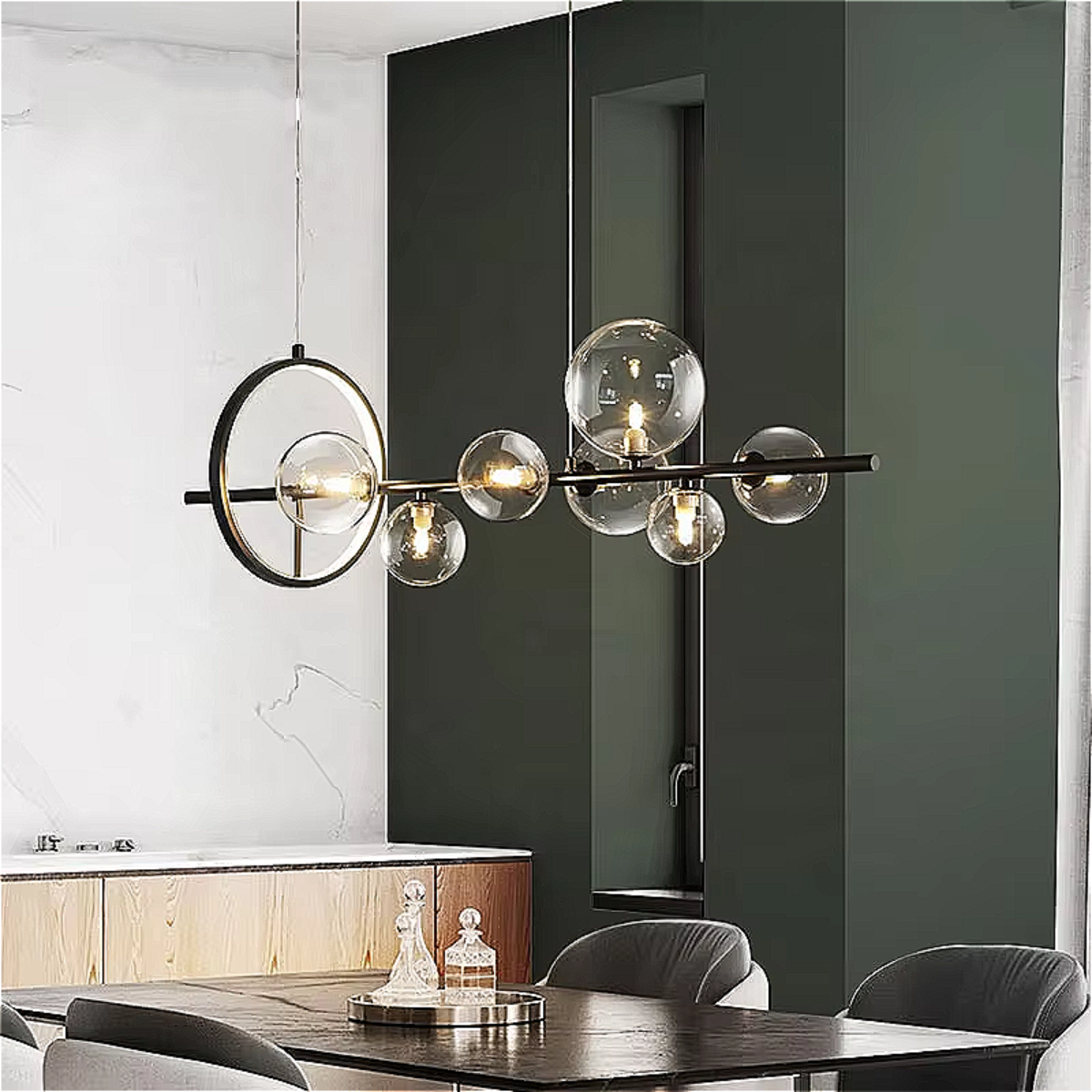 Sculptural linear glass chandelier with black frame suspended above a modern dining room — perfect for architectural and minimalist interiors.
