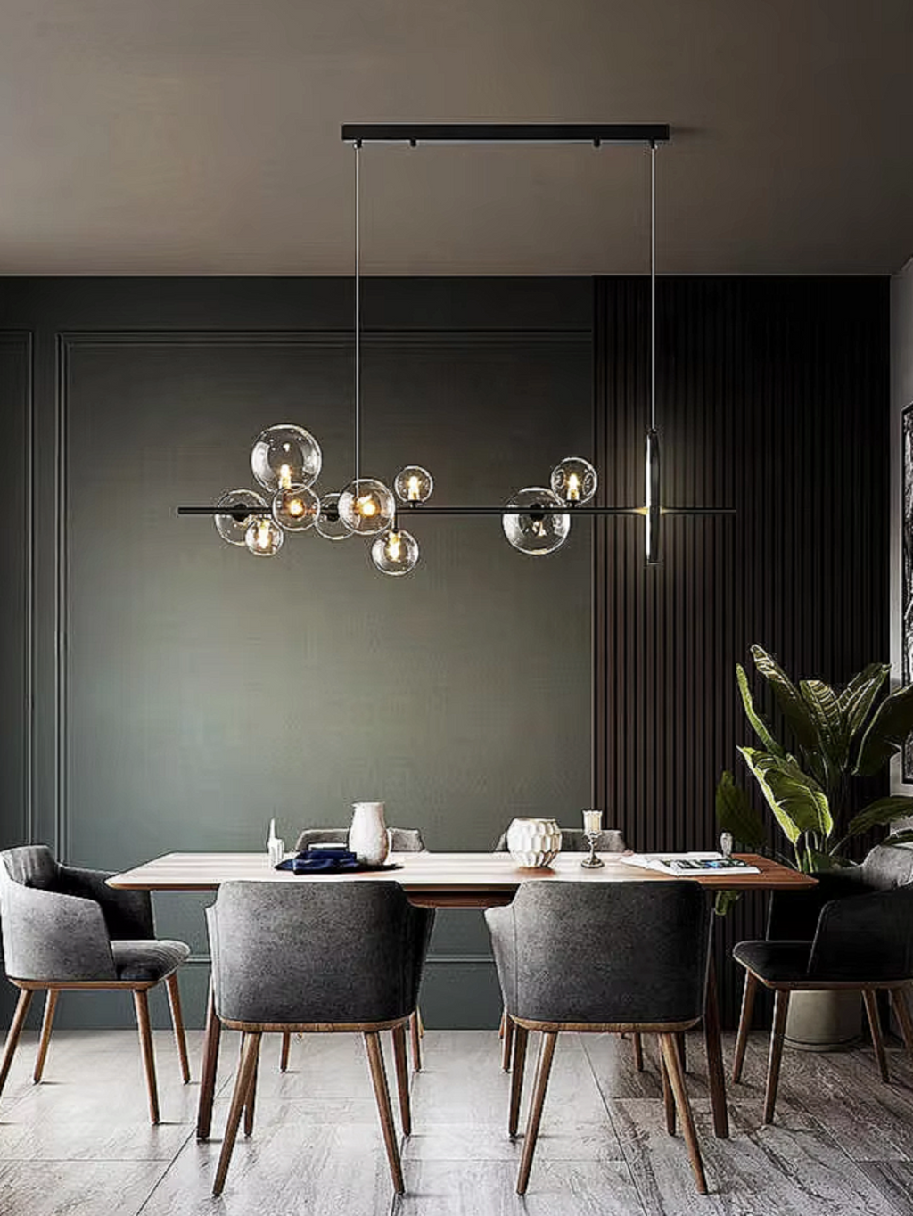 LINKORI TRUNKO L. NOIR black glass chandelier installed in a luxury dining room, featuring asymmetrical glass globes and matte black linear frame.
