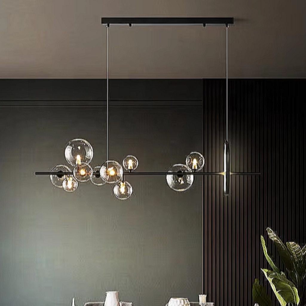 Sculptural linear glass chandelier with black frame suspended above a modern dining room — perfect for architectural and minimalist interiors.