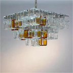 Geometric glass cube chandelier above modern living room — amber & clear statement pendant, mid-century modern & Art Deco styling | LINKORI CUBLIQUE living room view