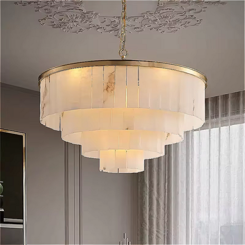 4-tier marble chandelier with gold trim installed in a modern luxury living room, creating sculptural ambient light.