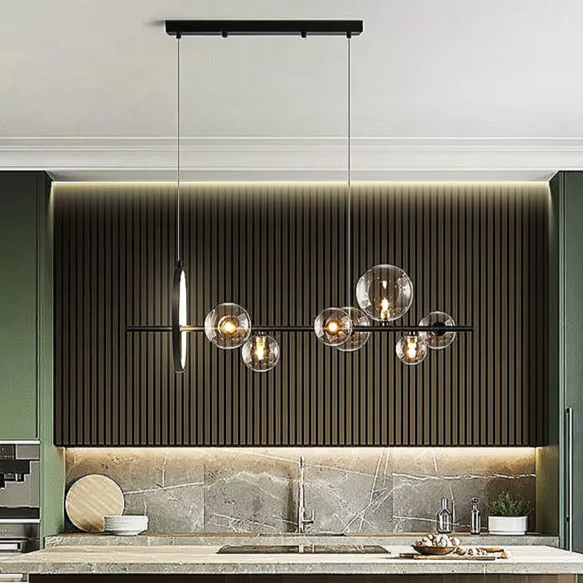 LINKORI TRUNKO NOIR black glass chandelier installed above a luxury kitchen island, featuring asymmetrical glass globes and matte black linear frame.