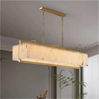 Modern gold alabaster linear chandelier with sculptural pendant design for contemporary dining room lighting