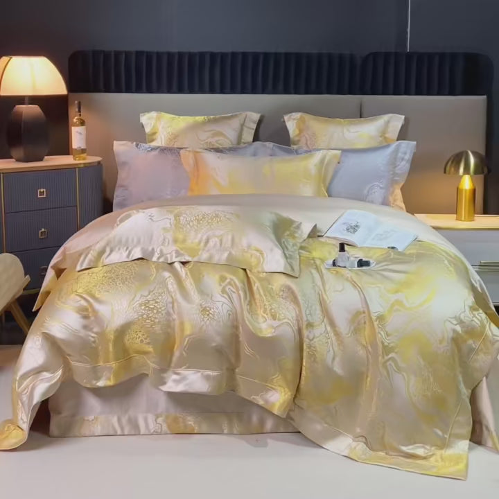 Elegant bedroom scene showcasing LINKORI The Royal Gold luxury bedding set featuring gold satin jacquard duvet cover, premium 100% Egyptian cotton fabric, 4 to 6-piece set with intricate baroque-inspired patterns, quilted texture, and layered pillows for a regal, sophisticated look.