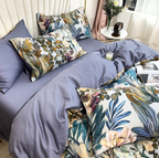 Close side angle of Mazorika bedding showing floral printed pillowcases and botanical duvet cover over a purple sheet base.