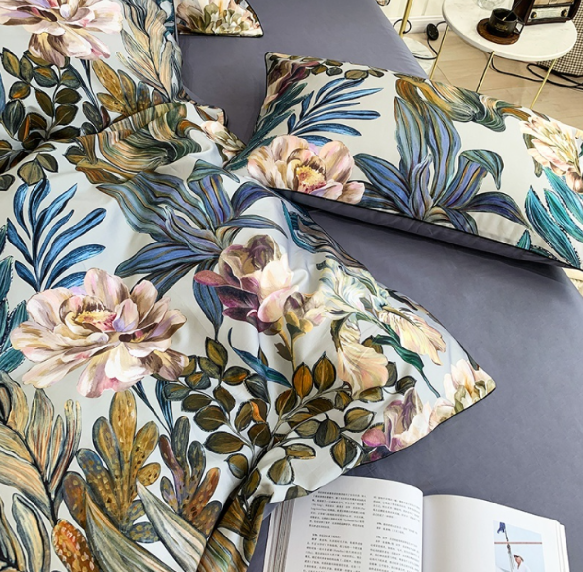 Pair of pillows with watercolor botanical print in earthy greens, violet, and blush — capturing nature-inspired elegance.