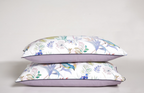 Reversible pillowcases showing botanical print on top and lavender underside from LINKORI Serenity set