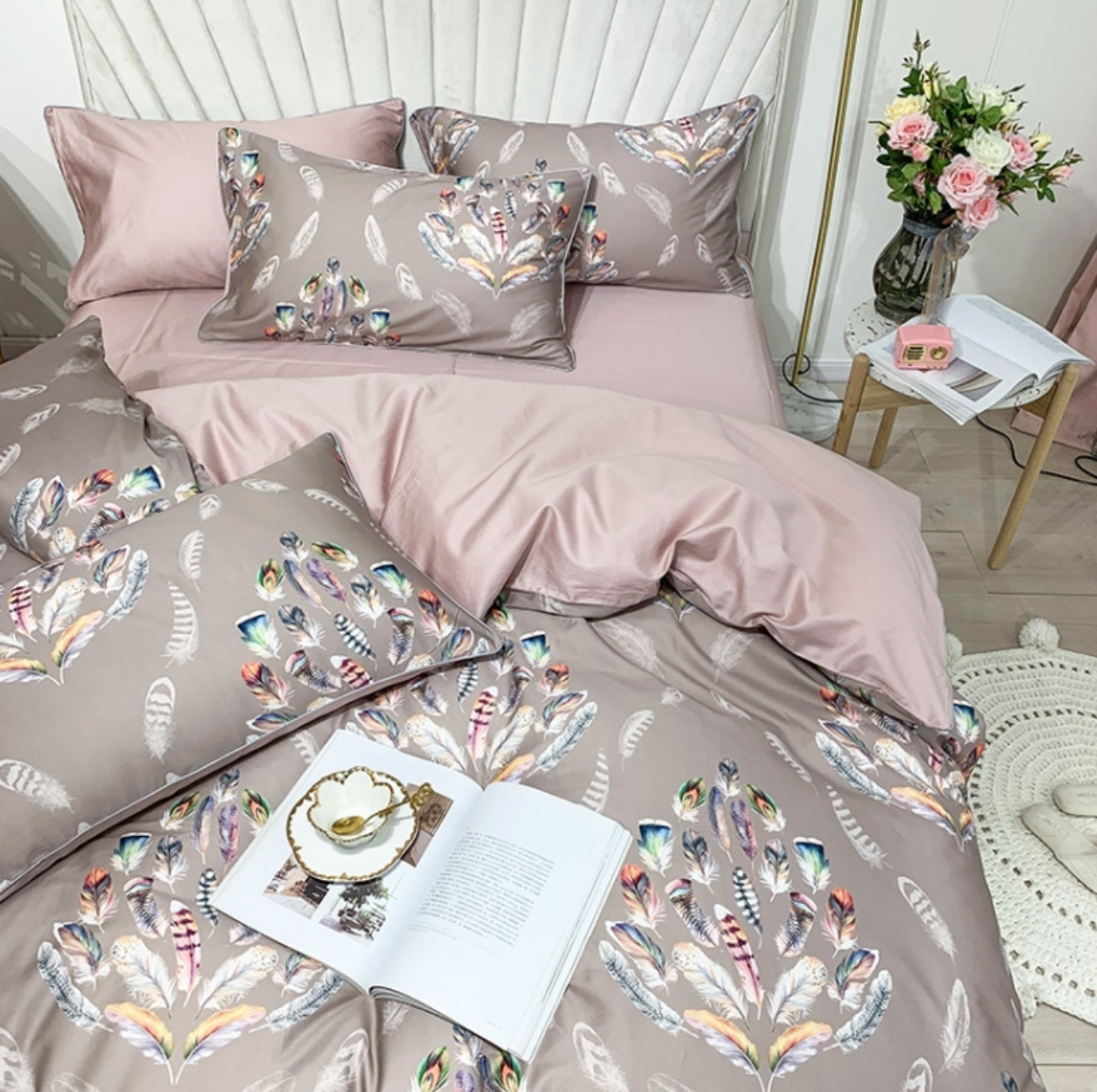 Feather-inspired pillowcases and pink flat sheet with reversible pink inner side of Egyptian cotton duvet cover