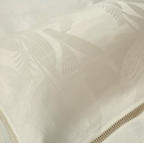 Close-up of ivory-beige leaf pattern on satin-finished Egyptian cotton pillow — elegant texture from LINKORI Lilela set.

