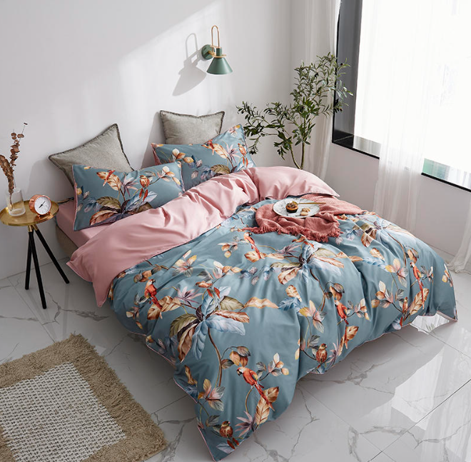 Side view of LINKORI Livelic 4-piece tropical bedding set with botanical and parrot design in a bright, modern bedroom