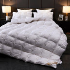 White quilted goose down comforter in modern classic bedroom – high-end bedding for luxury and timeless interior design