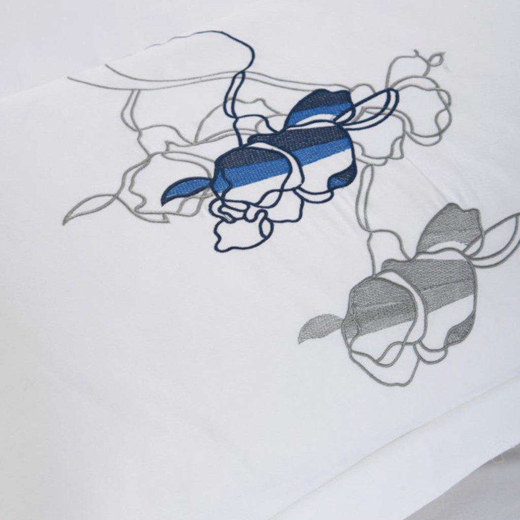 Detailed view of minimalist floral pattern in navy on white duvet cover – LINKORI Opisera’s refined simplicity