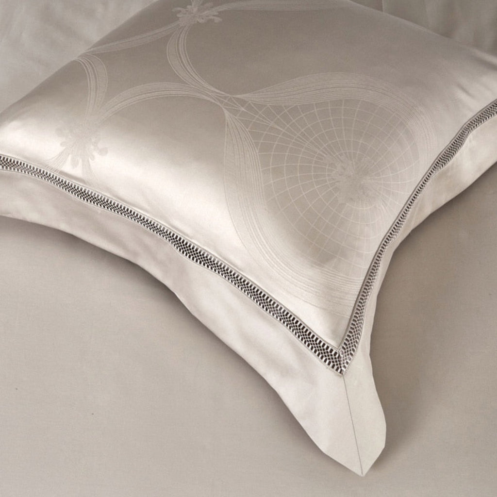 Close-up of single ivory jacquard pillow on flat sheet – LINKORI Elegant 4-piece Egyptian cotton bedding