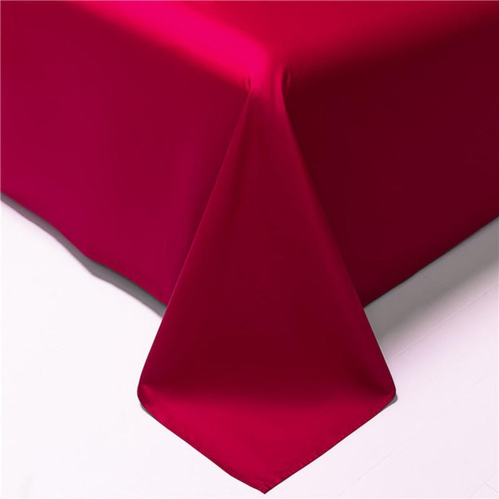 Close-up of red Egyptian cotton flat sheet stitching – high-quality luxury bedding with fine tailored finish