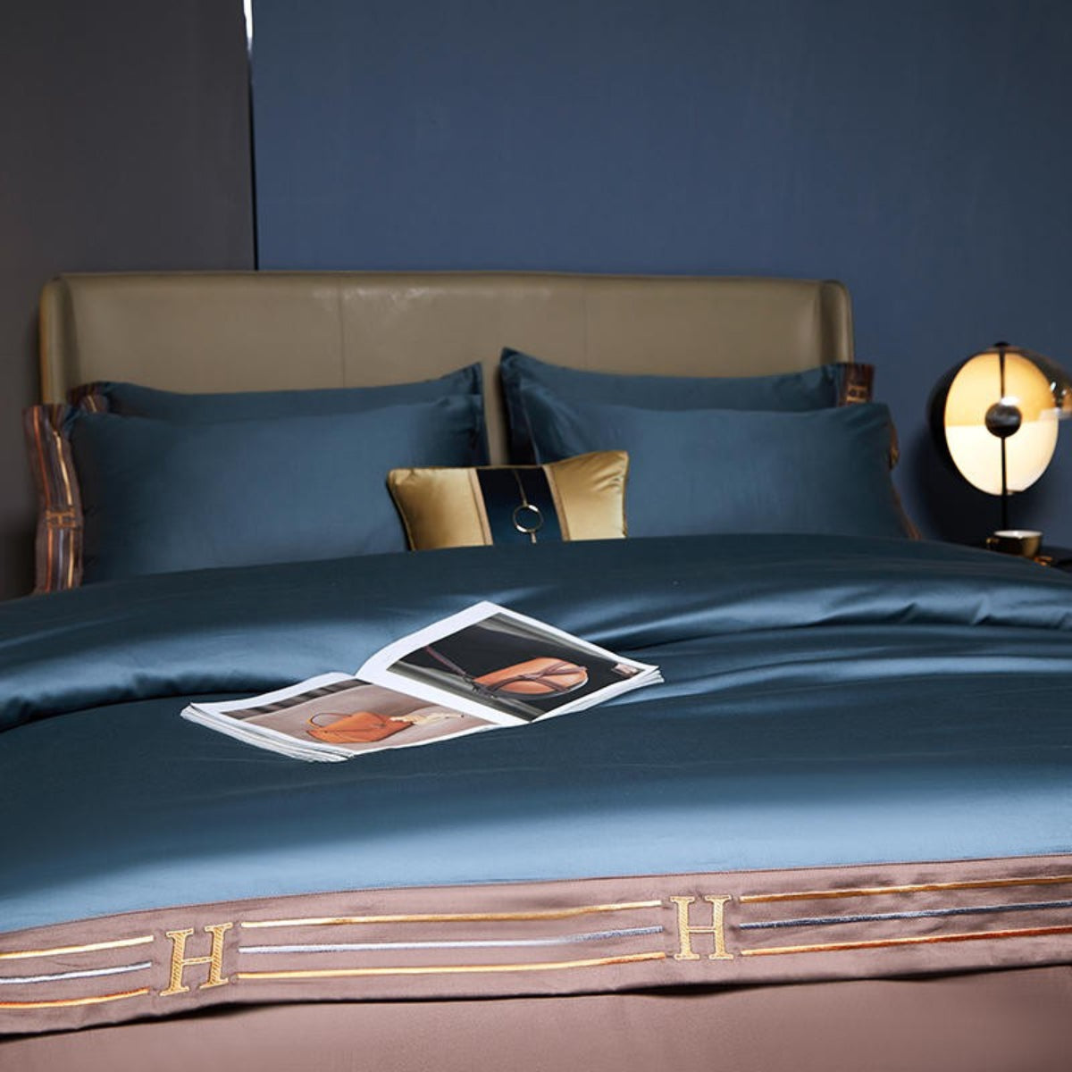 Blue Satin Egyptian duvet cover set with matching trim and sheet in modern bedroom