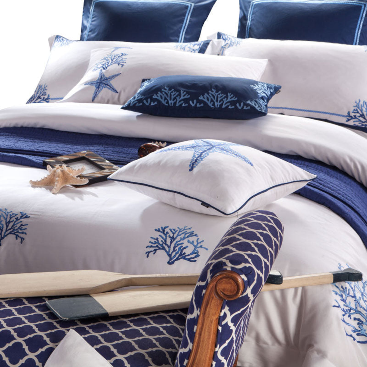 Close-up of full LINKORI Blue Coral bedding set including square pillows, flat sheet, and embroidered details