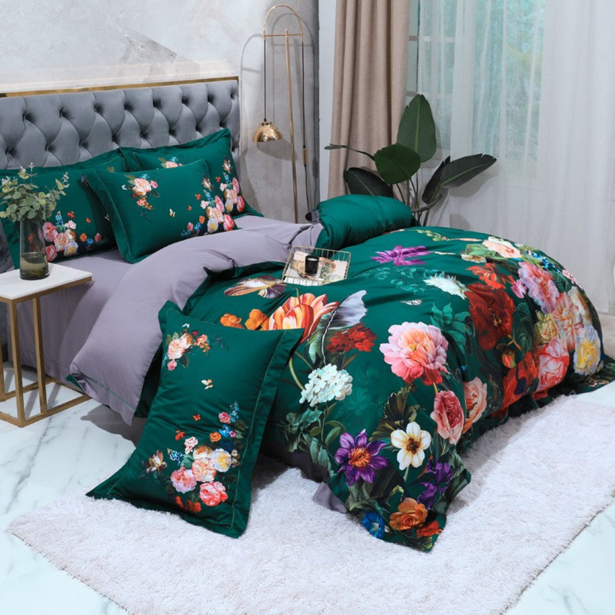 Side view of deep green botanical bedding with coordinating floral pillowcases and visible lavender flat sheet