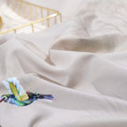 Close-up of LINKORI Fliflowers duvet texture and bird motif – silky Egyptian cotton with fine print detail