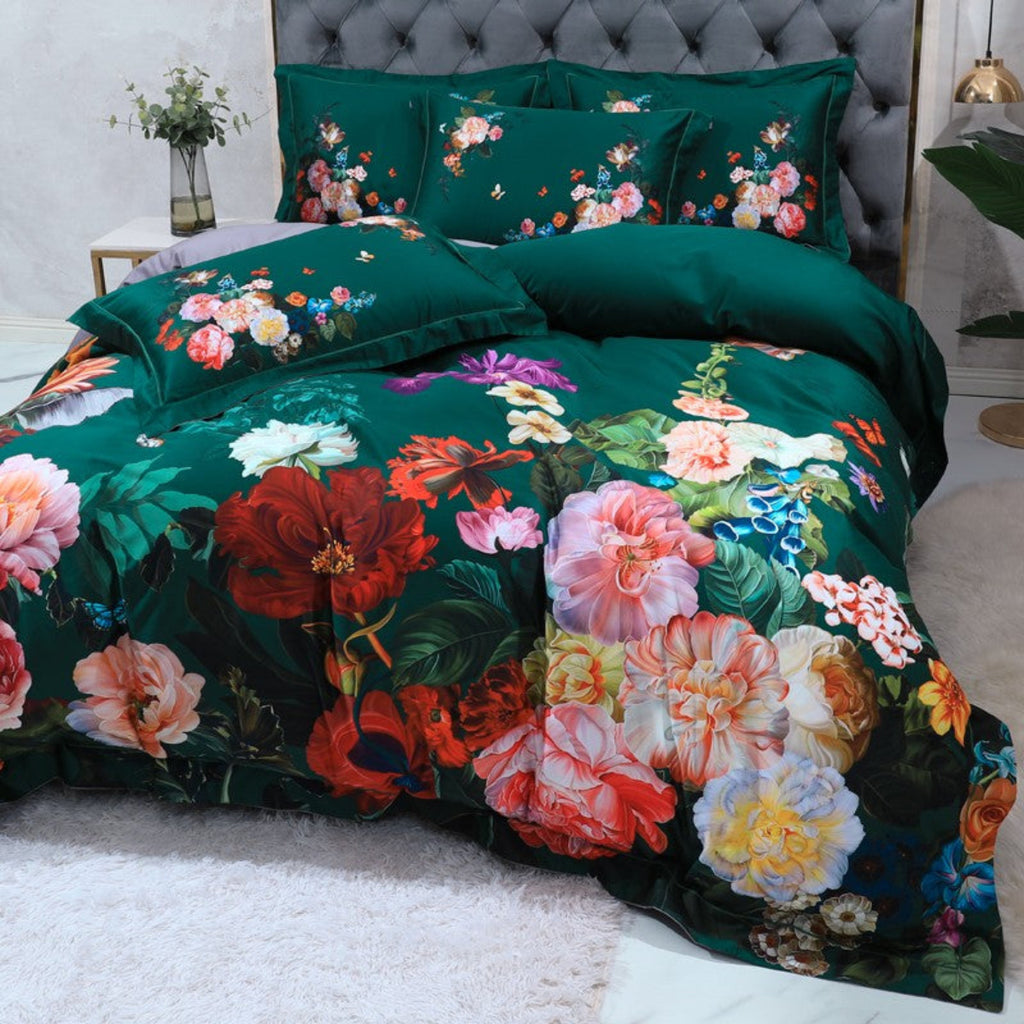 Artistic angled view of bold botanical duvet set in deep green with colorful blooming floral design – luxury maximalist bedding