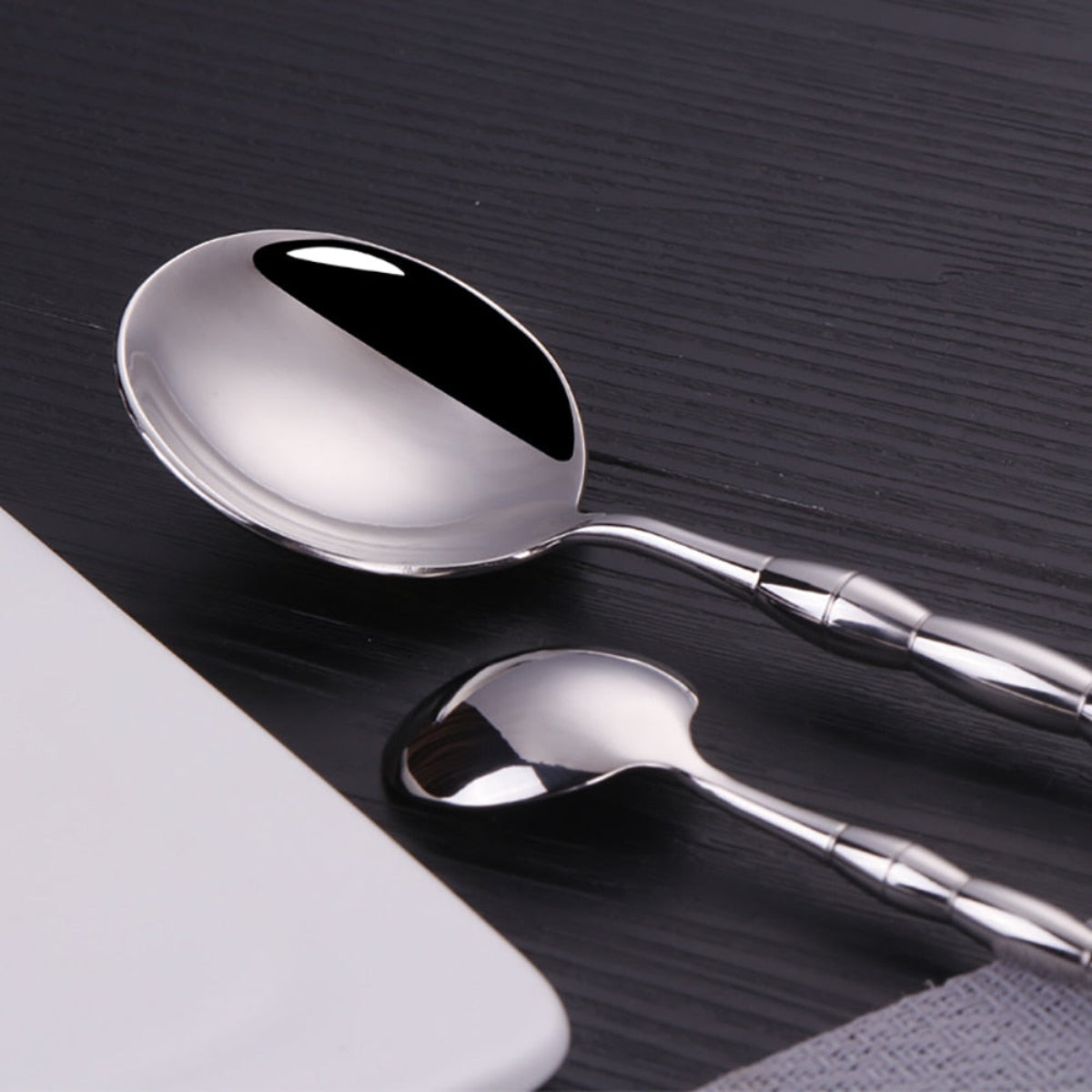 Modern silver dining set with jewel-like beaded handles and mirror-polished surface, perfect for luxury table setting and entertaining