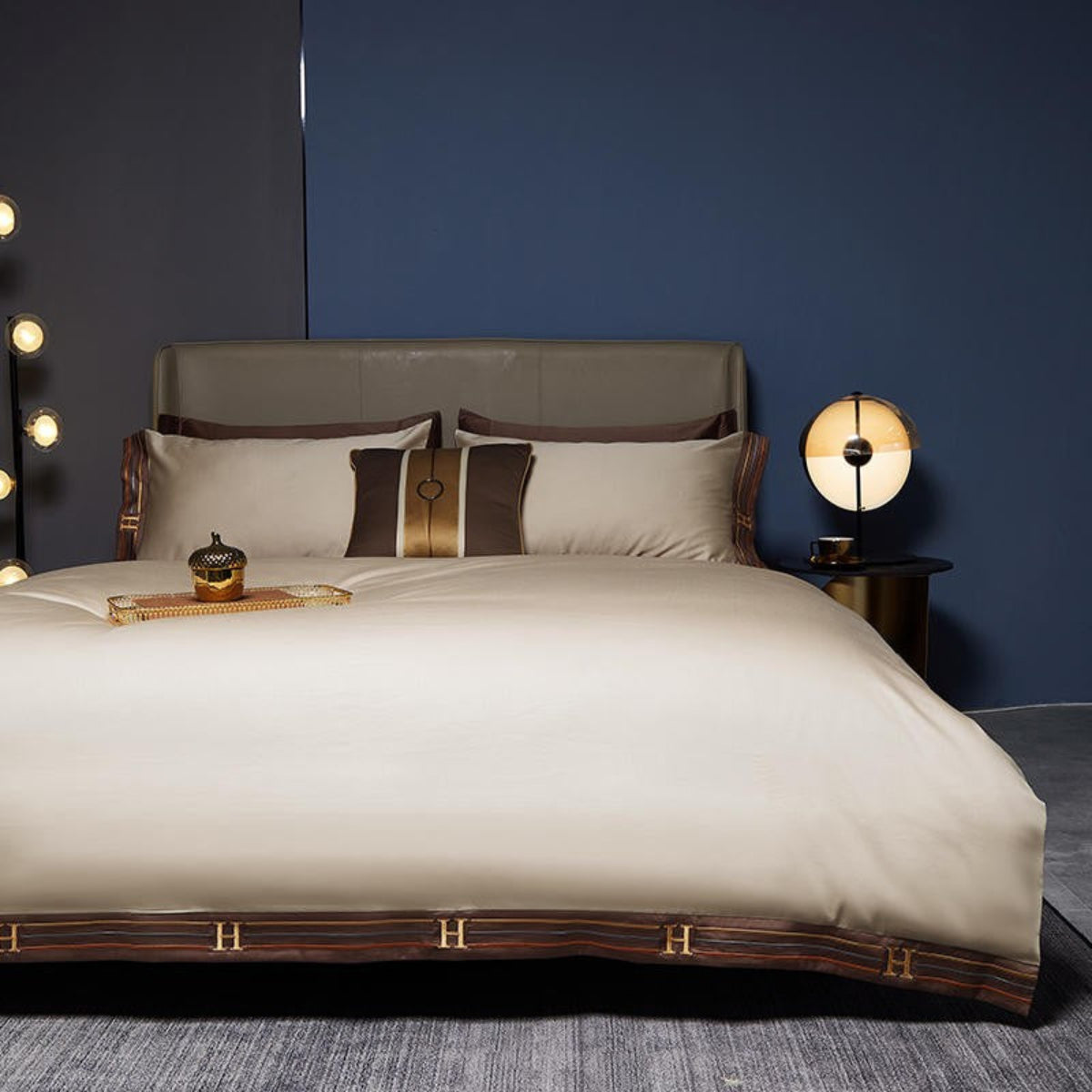 Warm beige satin bedding with brown edge ribbon and matching pillowcases on minimalist bed – 100% Egyptian cotton