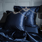 Navy blue pillows with gold embroidery from LINKORI Slivel S. – luxurious detailing on castlecore bedding