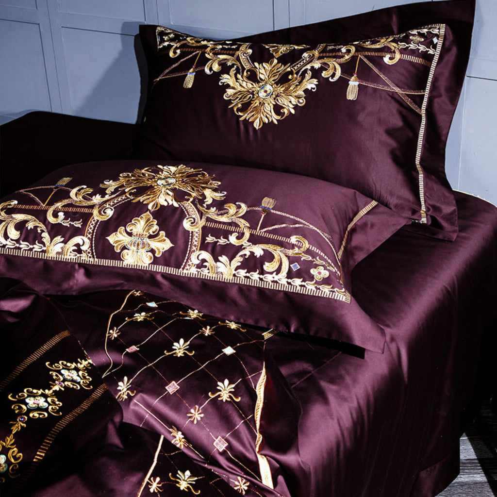 Close-up of gold baroque embroidery on plum Egyptian cotton pillowcases – luxury castlecore design