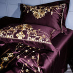 Close-up of gold baroque embroidery on plum Egyptian cotton pillowcases – luxury castlecore design