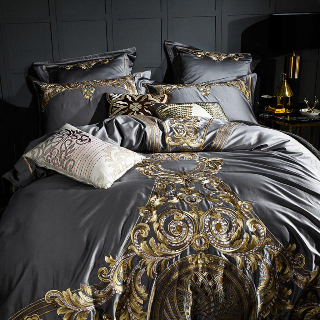 Close full shot of grey and gold baroque bedding set, highlighting texture, color contrast, and ornate detailing.