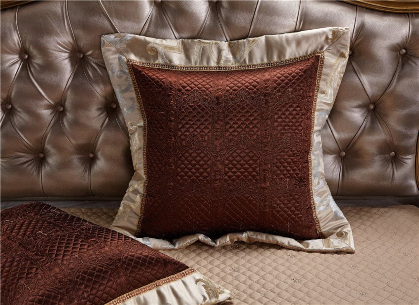 Dark red cushion on thick LINKORI Specto bedspread – contrast styling in regal jewel-tone bedroom