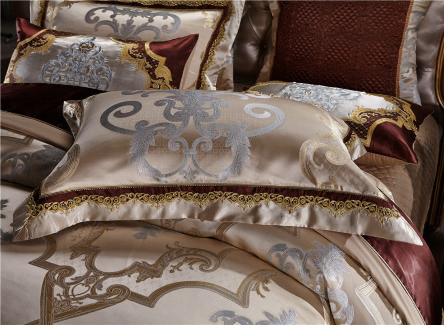 Close-up of LINKORI Specto duvet and pillows – detailed baroque embroidery on champagne silk cotton blend