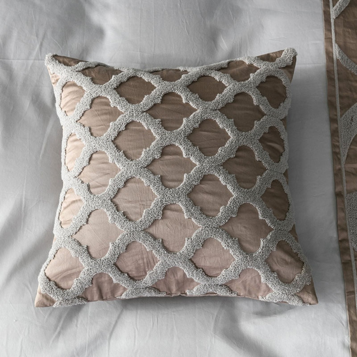 Focused shot of the small decorative pillow with textured embroidery, part of the 7-piece LINKORI Kurble luxury bedding ensemble.