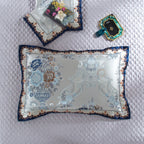 Decorative pillows placed over LINKORI Highclatan bedspread – showcasing baroque embroidery and symmetry