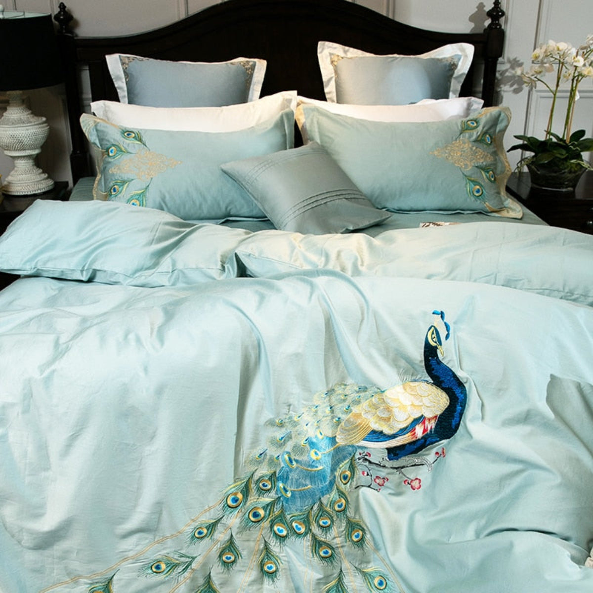 Close-up of two mint pillows and central peacock embroidery on LINKORI Drupoke duvet cover, showing refined color contrast.