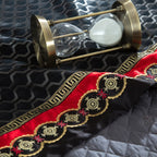Close-up of gold embroidered pattern on black satin duvet cover with elegant jacquard finish | LINKORI Stapun Black