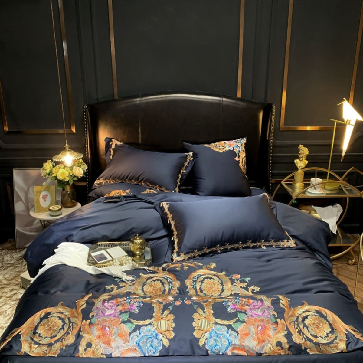 Top-down view of black Egyptian cotton duvet set with symmetrical embroidery and matching pillows, showcasing overall layout.
