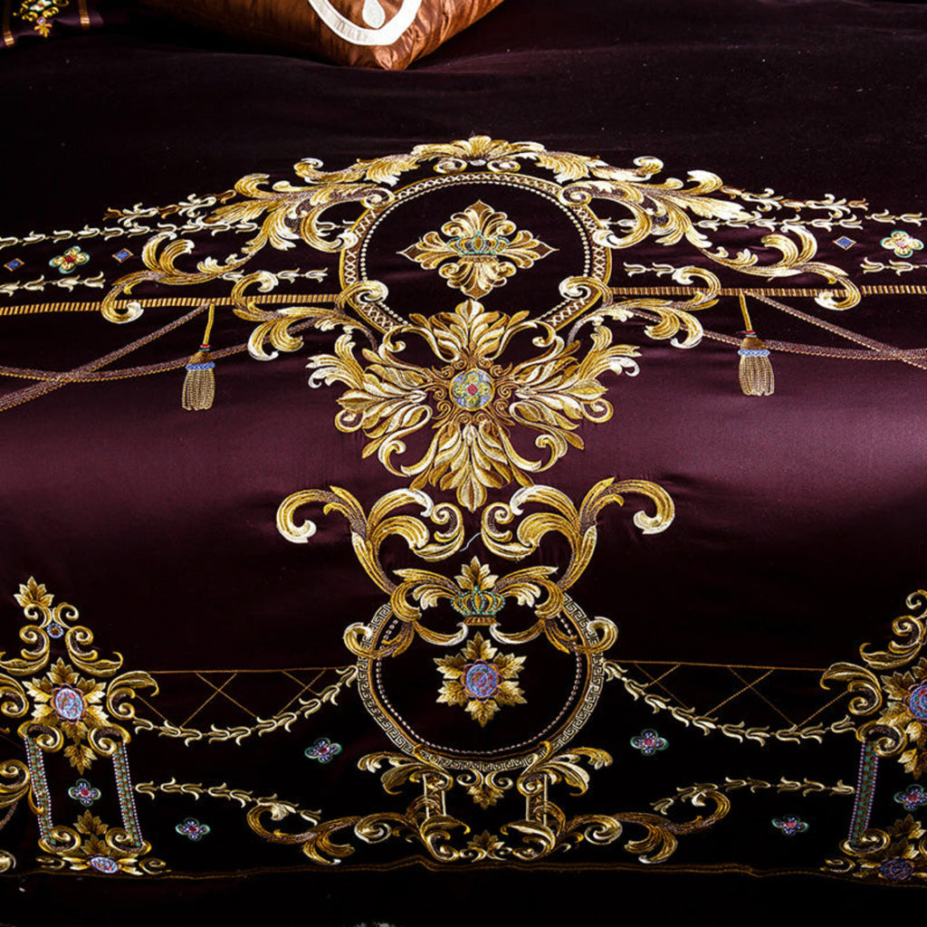Intricate gold embroidery detail on plum duvet cover – tribute silk craftsmanship with regal design