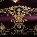 Intricate gold embroidery detail on plum duvet cover – tribute silk craftsmanship with regal design