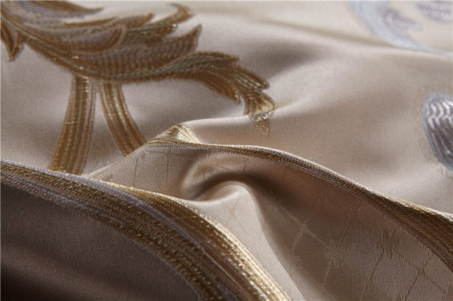 Close-up of gold baroque embroidery on silk cotton fabric – LINKORI Specto luxury textile finish