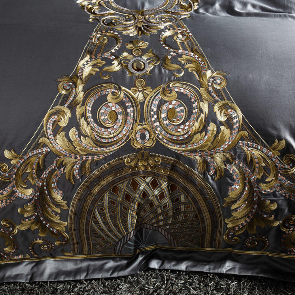 Detailed close-up of gold baroque embroidery on silky grey Egyptian cotton duvet cover.