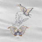 Close-up of the embroidered butterfly design on the duvet cover, showcasing tribute silk craftsmanship and fine detail.