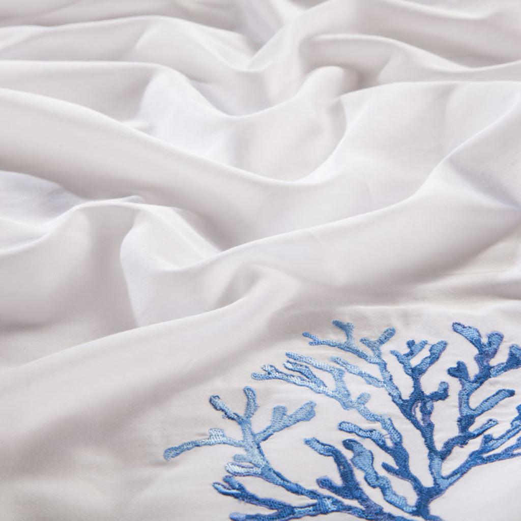 Macro shot of coral and starfish embroidery on silky-soft Egyptian cotton duvet cover – LINKORI Blue Coral