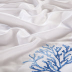 Macro shot of coral and starfish embroidery on silky-soft Egyptian cotton duvet cover – LINKORI Blue Coral