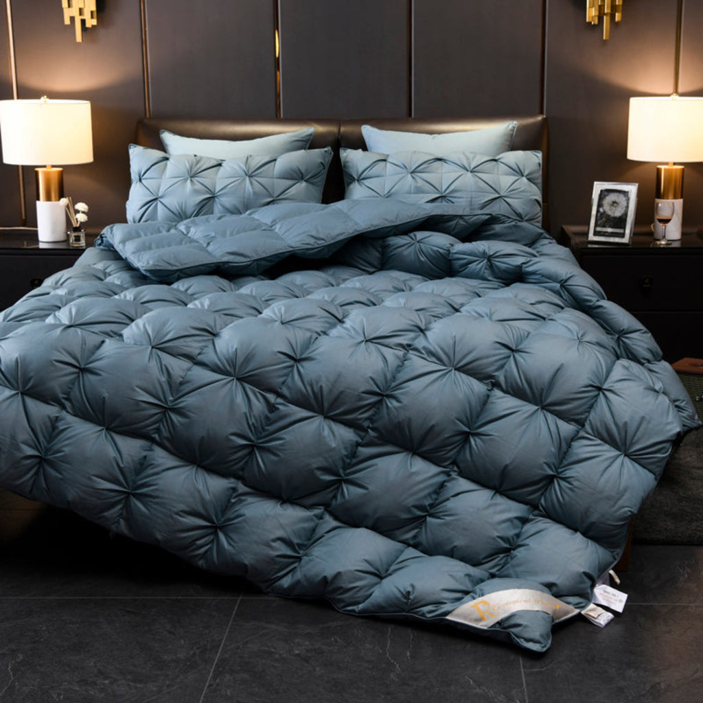 Overhead full view of LINKORI Blue Luxurious comforter fully spread to showcase its volume, geometric texture, and blue sheen.
