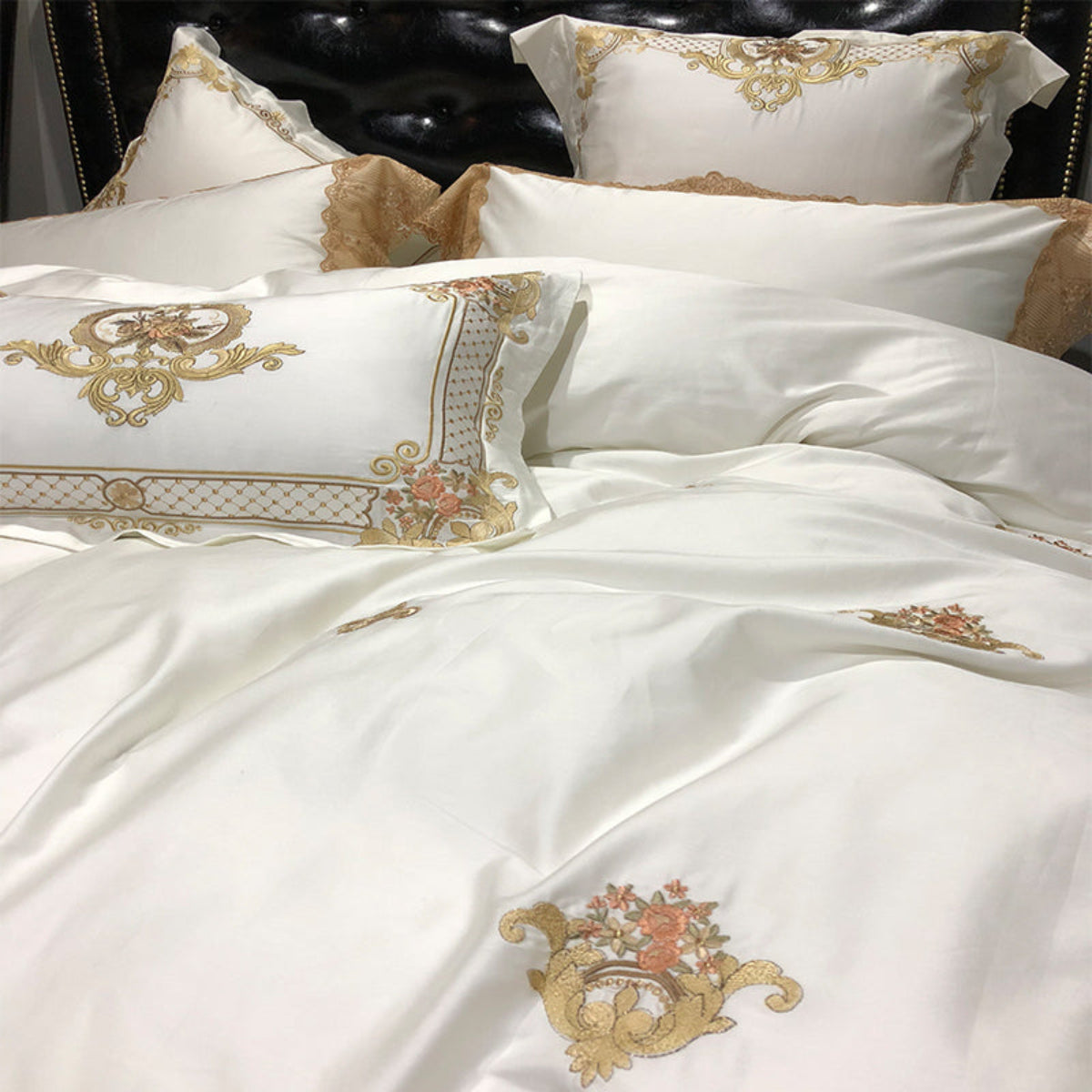 Close-up of LINKORI Stonge Royal duvet cover and matching pillowcases with intricate golden embroidery