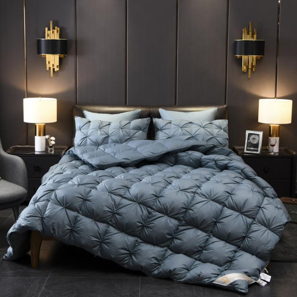 Full front view of LINKORI Blue Luxurious goose down comforter with sculpted quilting in rich blue tone, styled in modern bedroom.