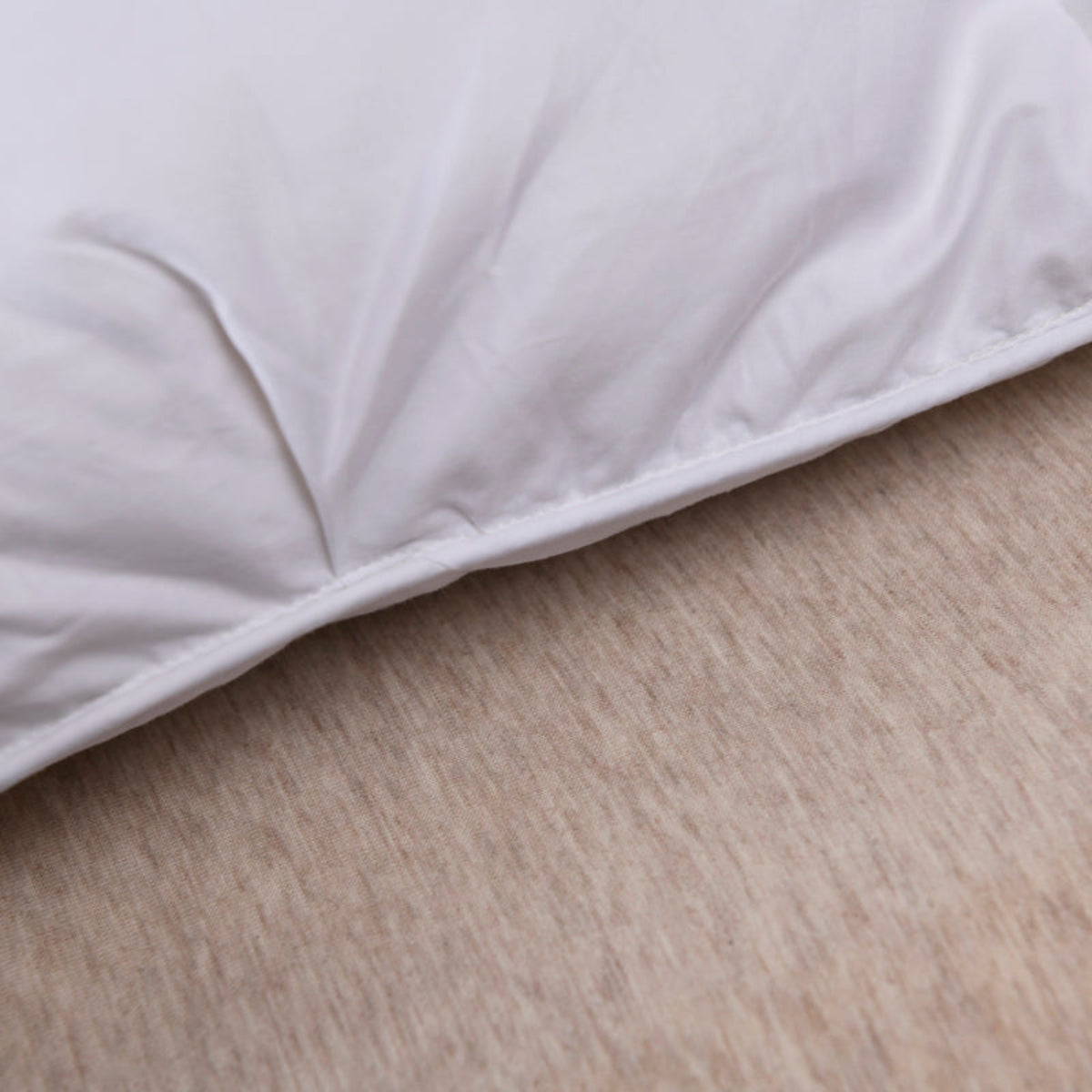 Sculptural quilt pattern on luxury white goose down comforter – hotel-grade elegance with premium cotton shell

