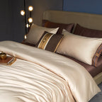 Side view of full beige satin bedding set with brown flat sheet and detailed embroidery trim – soft silky duvet
