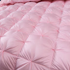 Detail of pink comforter fabric – showcasing breathable cotton texture and blush tone

