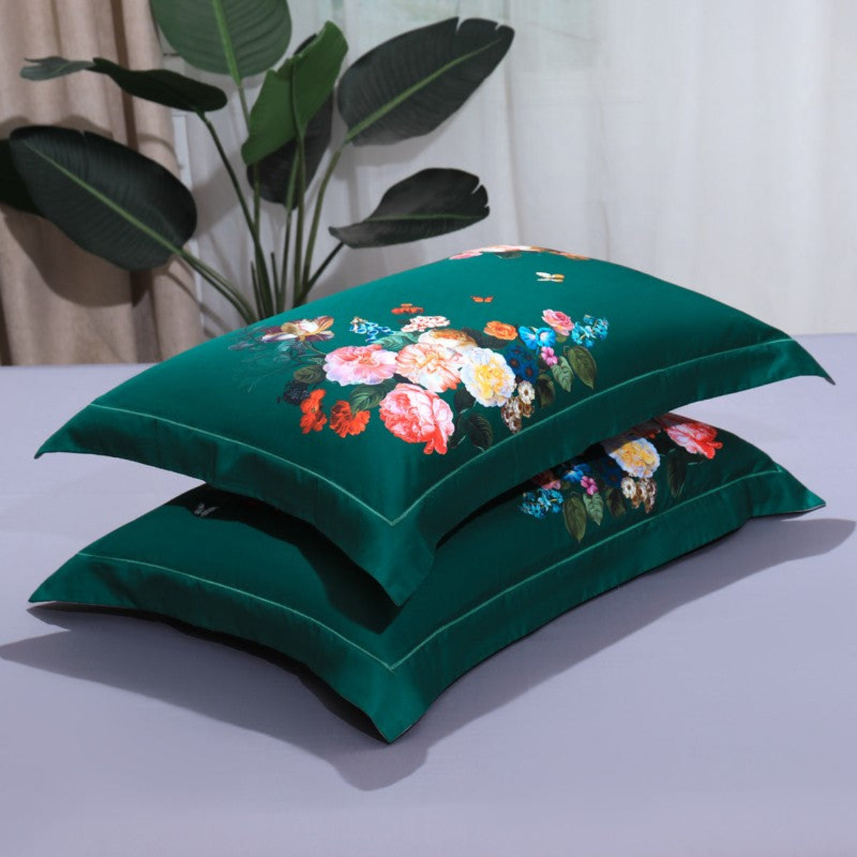 Two floral pillowcases resting on soft lavender flat sheet, part of the LINKORI G. The Flowers 4-piece set